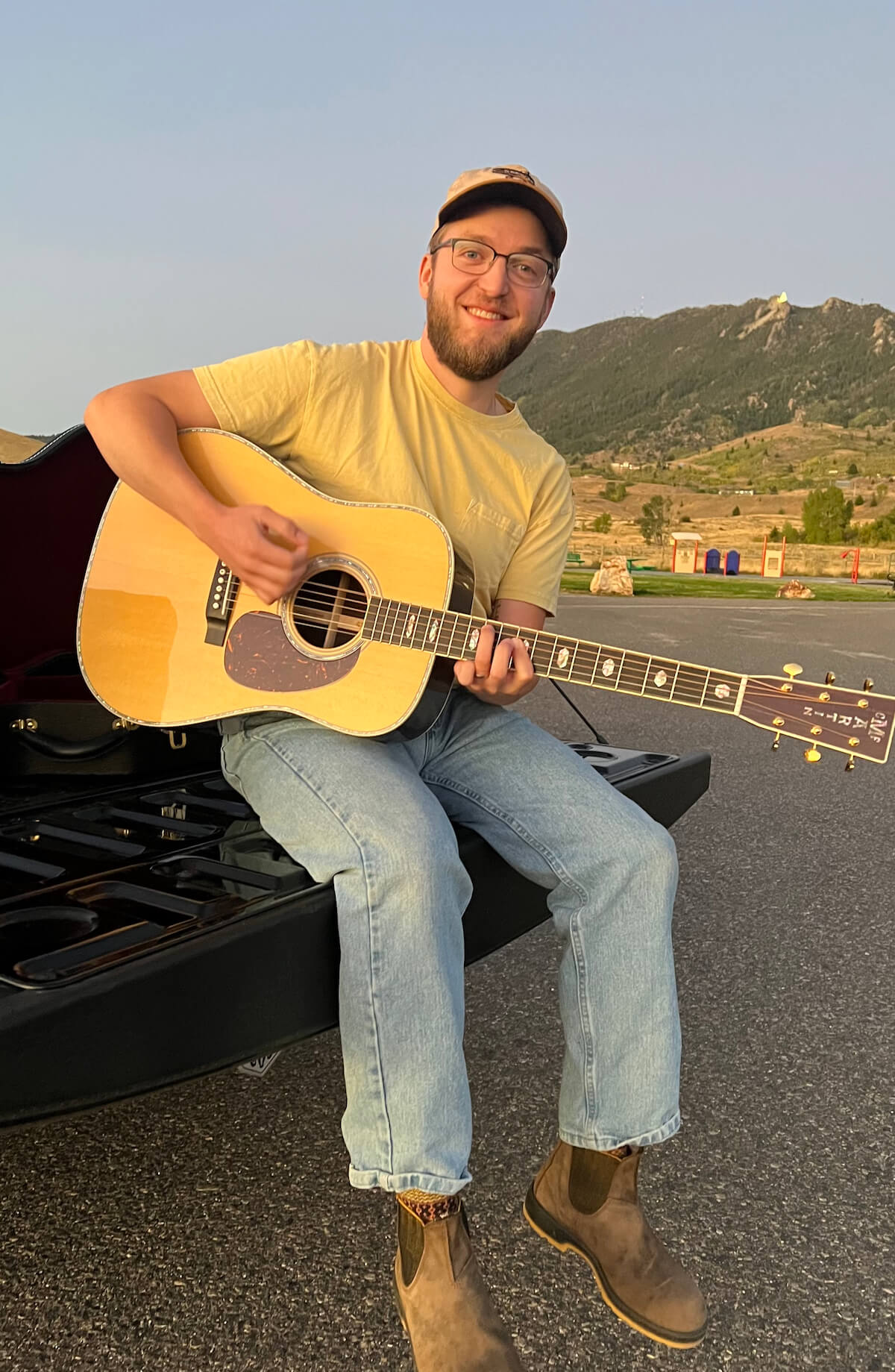 Scott Mathson Music artist image - with his acoustic in western Montana
